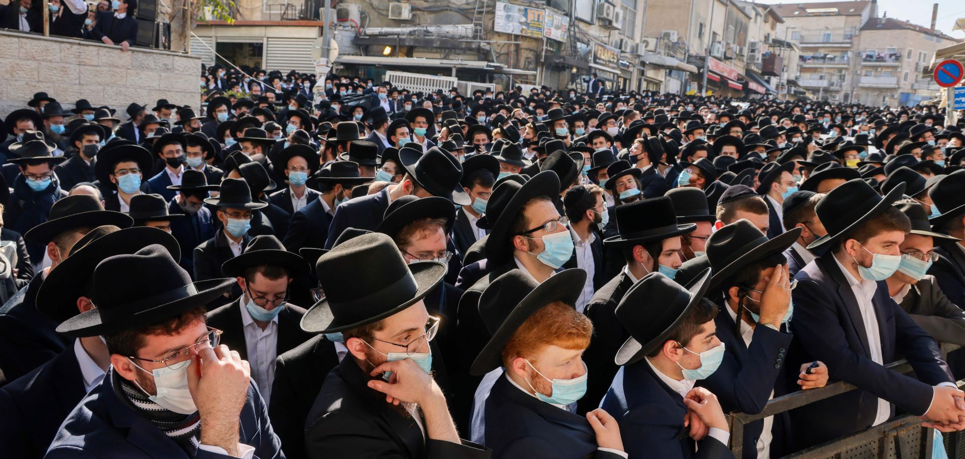 Ultra-Orthodox Jewish men attend the funeral of Rabbi Aharon David Hadash, the spiritual leader of the Mir Yeshiva, in Jerusalem's ultra-Orthodox neighborhood of Beit Yisrael on Dec. 3, 2020.
