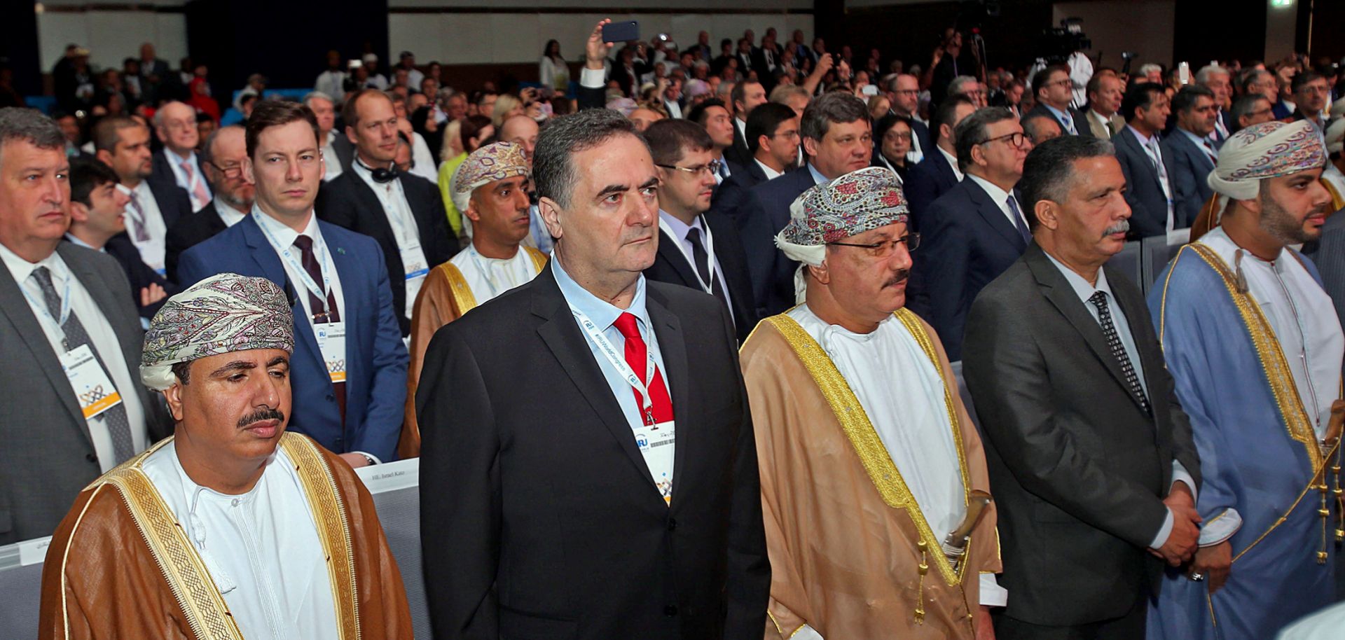 Israeli Transportation Minister Yisrael Katz, second from left, stands during the opening ceremony of the IRU World Congress, a regional transportation conference, in Muscat, Oman, on Nov. 7, 2018.