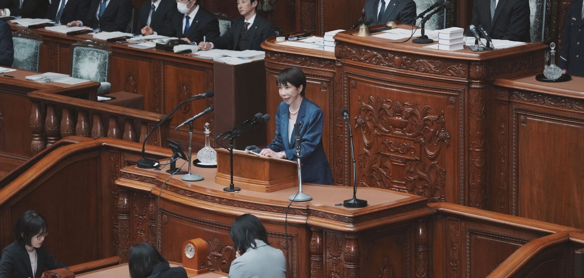 Japanese Prime Minister Sanae Takaichi (C) answers questions during a plenary session of the House of Representatives at Parliament on March 26 in Tokyo.