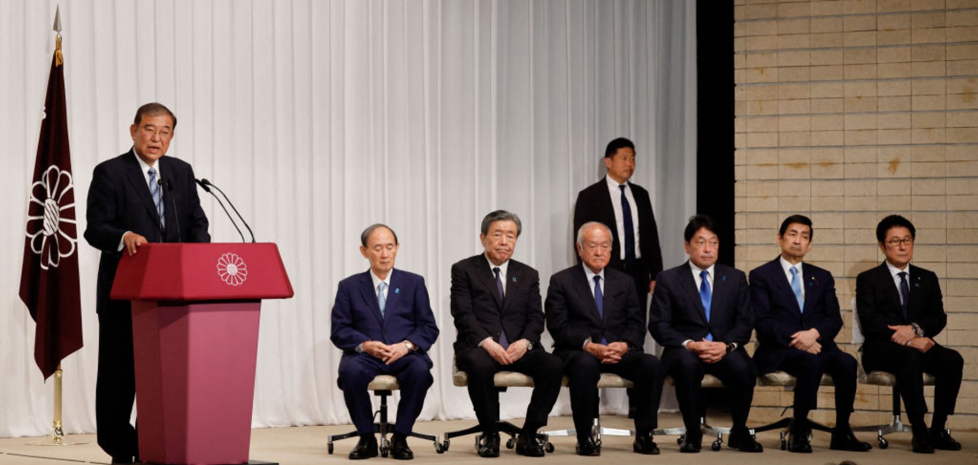 Japanese Prime Minister Shigeru Ishiba (left) speaks next to leaders of his ruling Liberal Democratic Party (LDP) during a press conference at the LDP's headquarters in Tokyo on Oct. 28, 2024. 