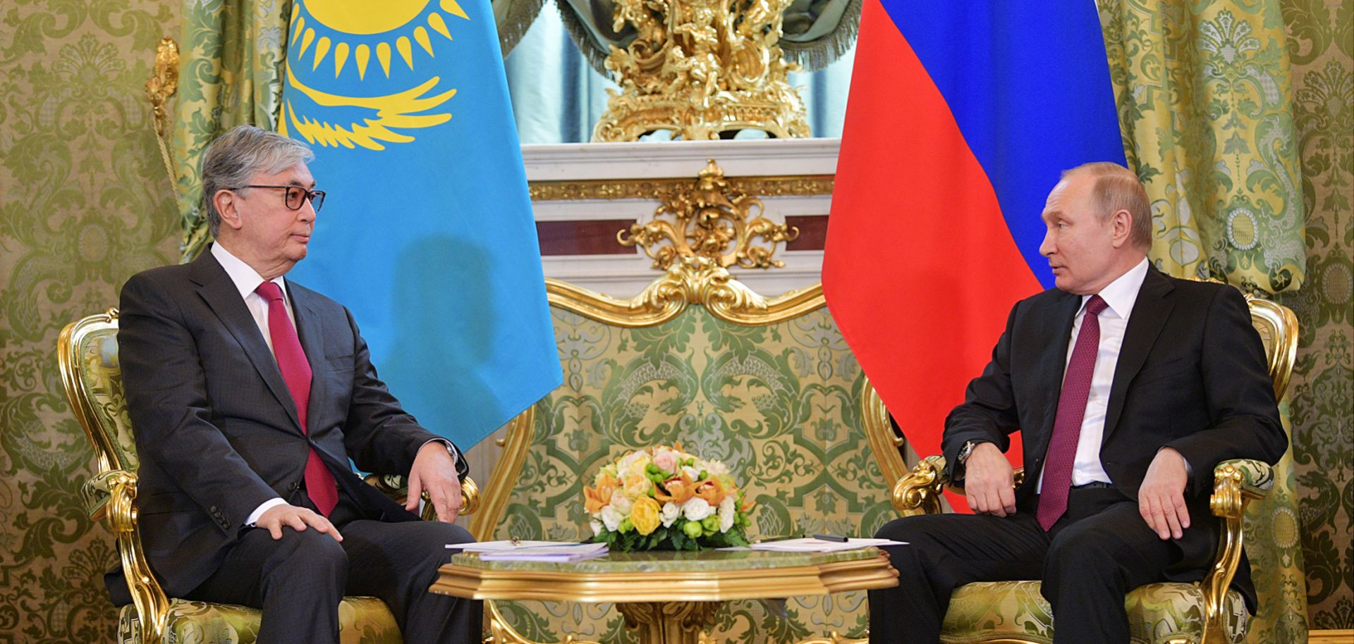Kazakhstan's acting President Kassym-Jomart Tokayev sits next to Russian President Vladimir Putin during a meeting at the Kremlin. 