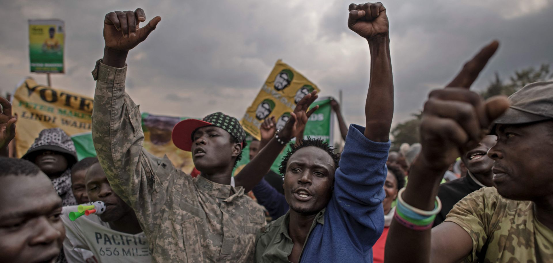 Supporters react to Kenyan Deputy President William Ruto’s speech during a presidential campaign rally in Kibera, the largest slum in Nairobi, on Jan. 18, 2022.