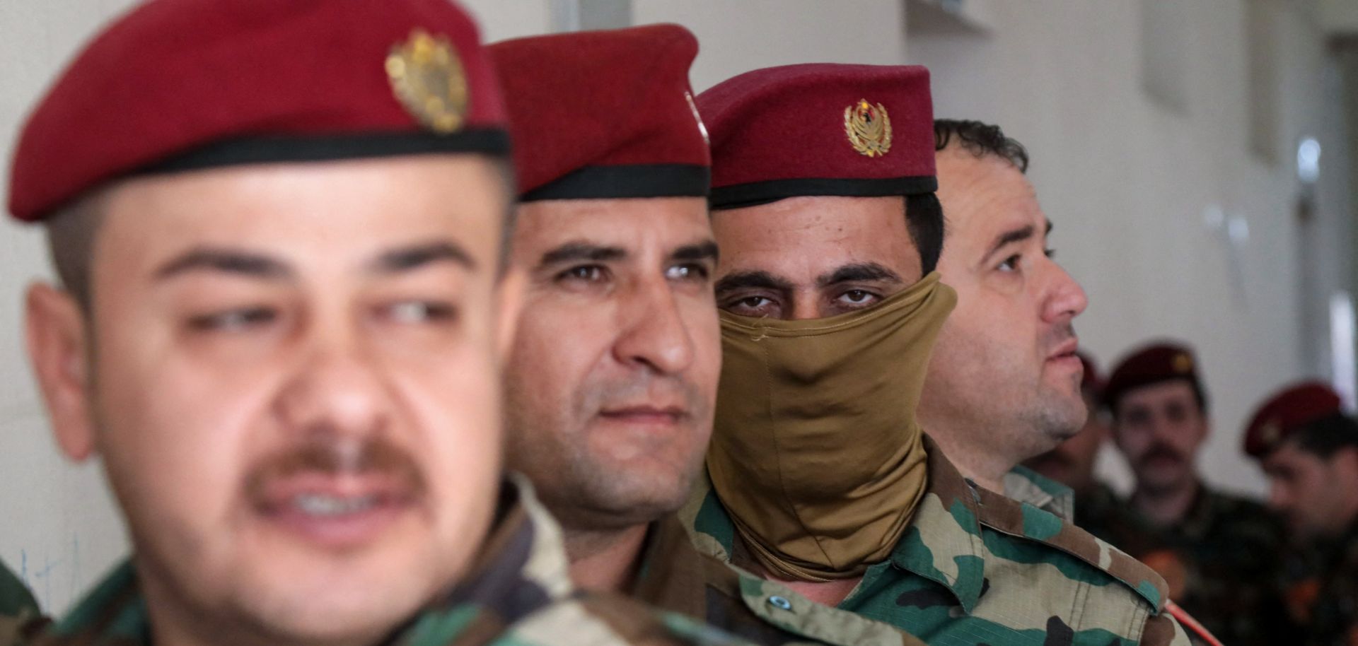 Members of the Kurdish peshmerga security forces queue at a polling station to vote ahead of the Oct. 20 parliamentary election in Arbil, the capital of Iraq's autonomous Kurdish region, on Oct. 18, 2024. 