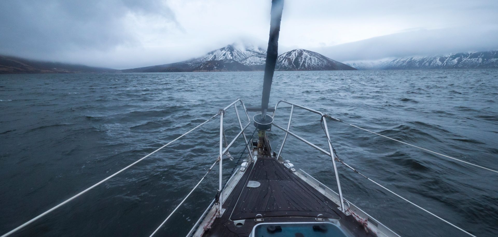 The Kuril Islands appear on the horizon as a boat approaches.