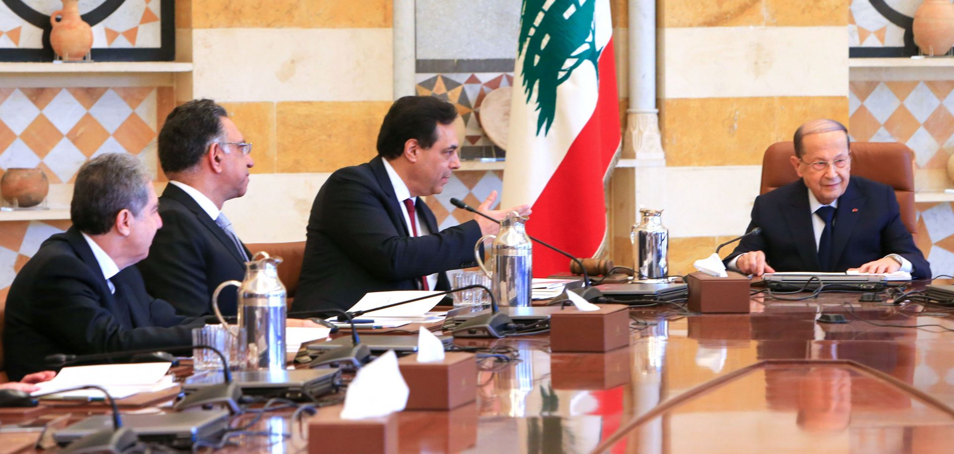 Lebanese President Michel Aoun (R) heads the first meeting of Prime Minister Hassan Diab's (C) newly constituted government in Beirut on Jan. 22, 2020.