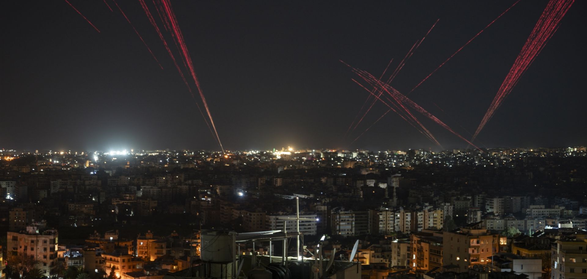 People in Beirut fire bullets into the sky to celebrate the new Lebanon-Israel ceasefire agreement on April 16, 2026. 