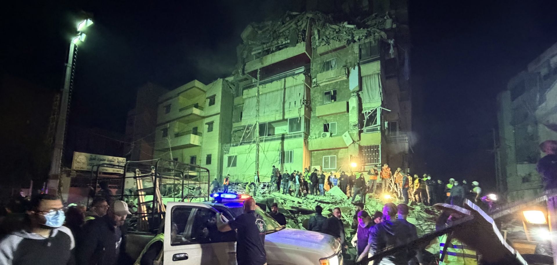 People gather at the site of an Israeli airstrike that targeted Beirut's southern suburbs on May 6, 2026.