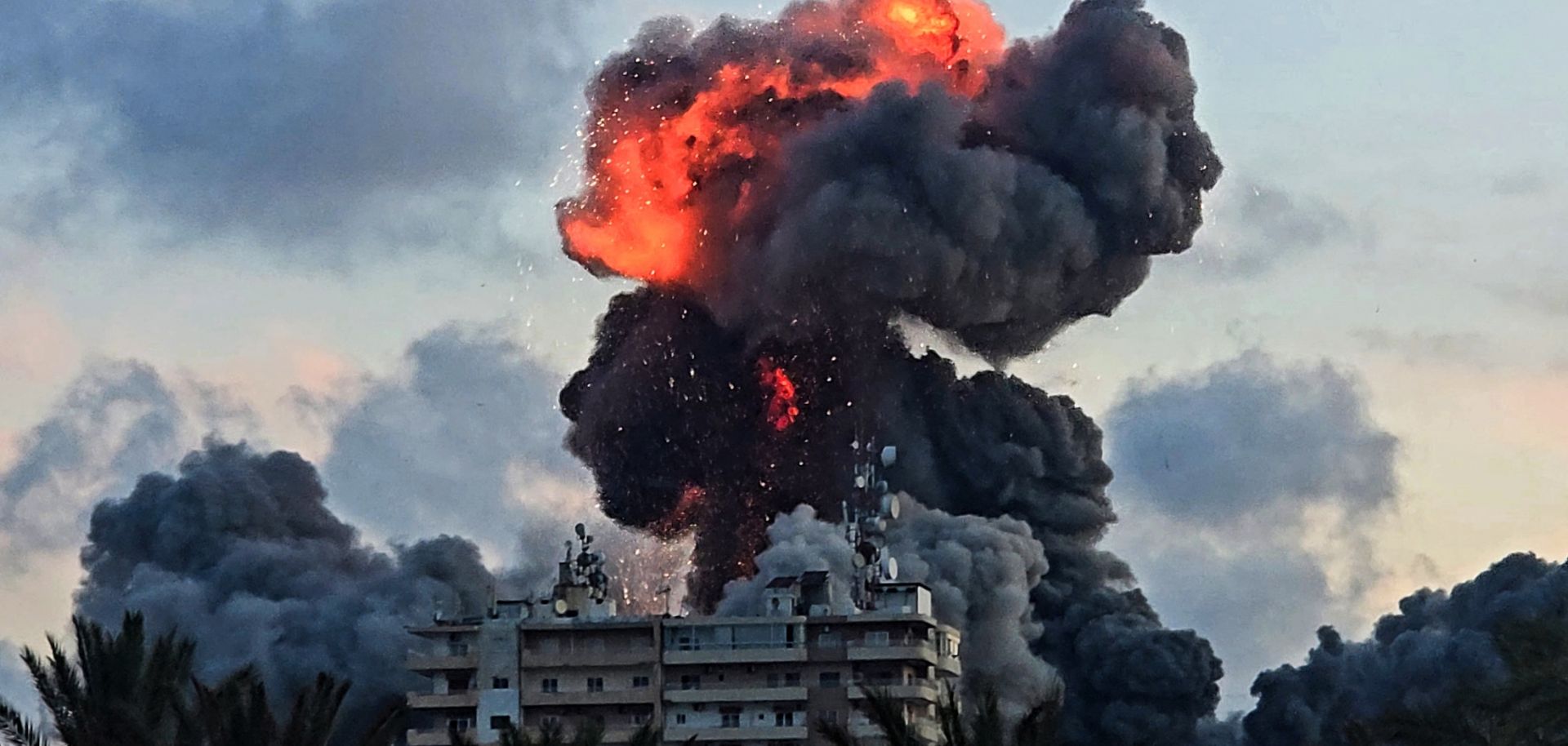 A fireball and smoke erupt from a building following an Israeli strike in Tyre, southern Lebanon, on May 28.