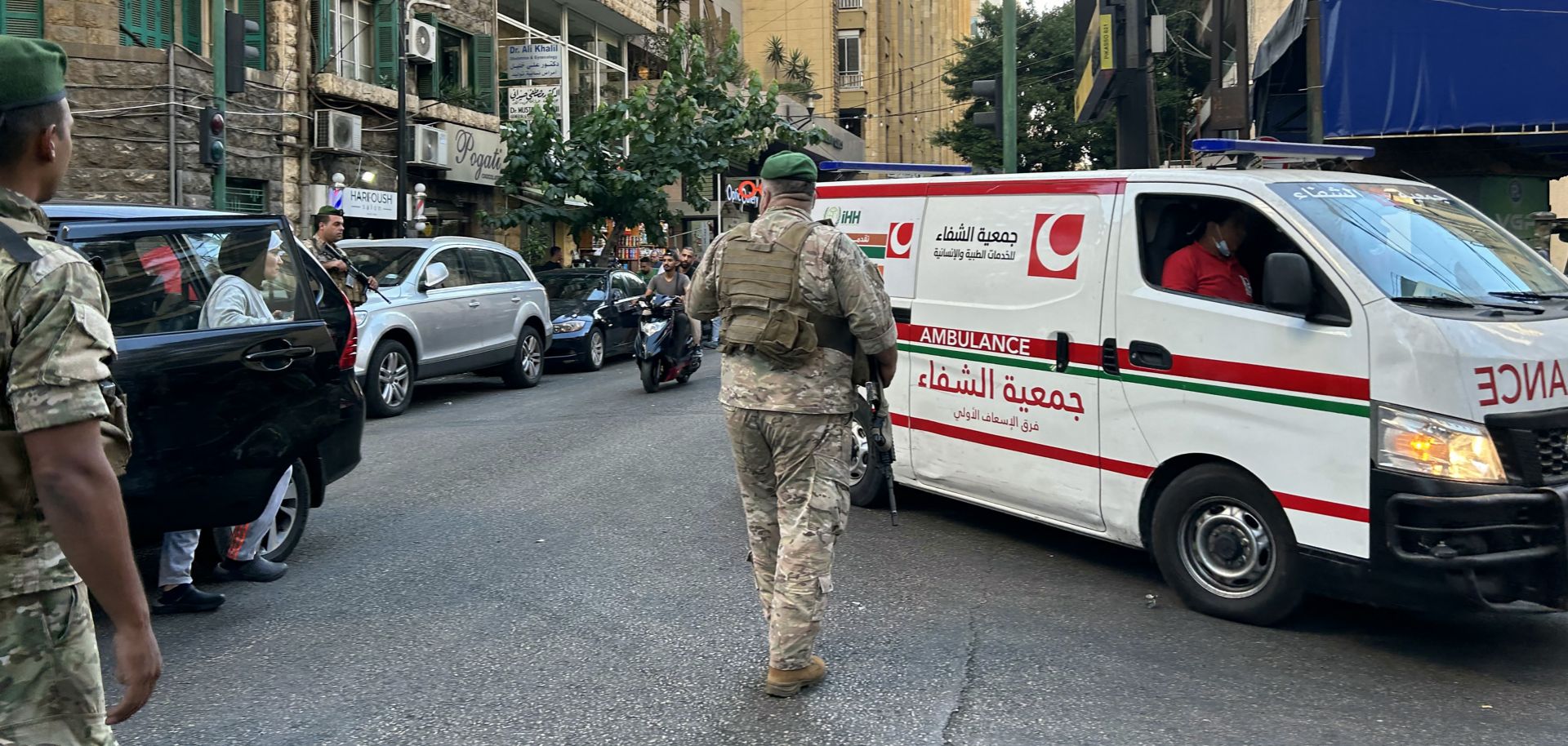 Lebanese soldiers stand guard as an ambulance rushes wounded people to a hospital in Beirut on Sept. 17, 2024, after explosions hit locations in several Hezbollah strongholds around Lebanon amid ongoing cross-border tensions between Israel and Hezbollah fighters.