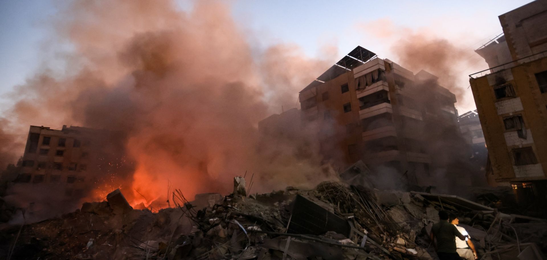 Smoke rises from rubble at the scene of Israeli air strikes in the Haret Hreik neighborhood of Beirut's southern suburbs on Sept. 27, 2024.