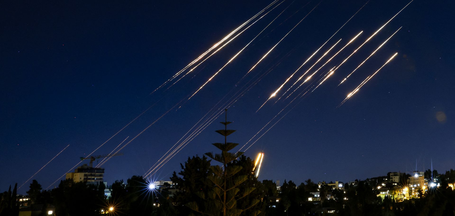Missiles fired from Iran are pictured in the night sky over Jerusalem, Israel, on June 14, 2025.