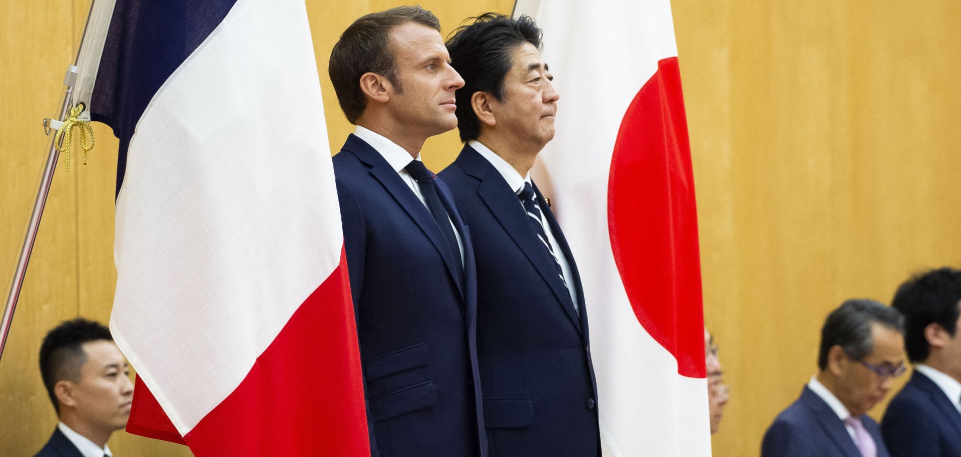 Japanese Prime Minister Shinzo Abe and French President Emmanuel Macron attend an official ceremony in Tokyo on June 26, 2019.