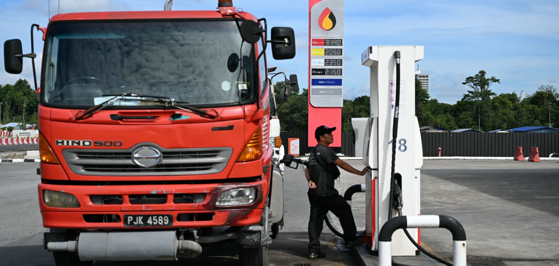 A man fills up his truck at a Petroleum Sarawak Berhad (Petros) station in Kuching, Malaysia, on June 20, 2025.