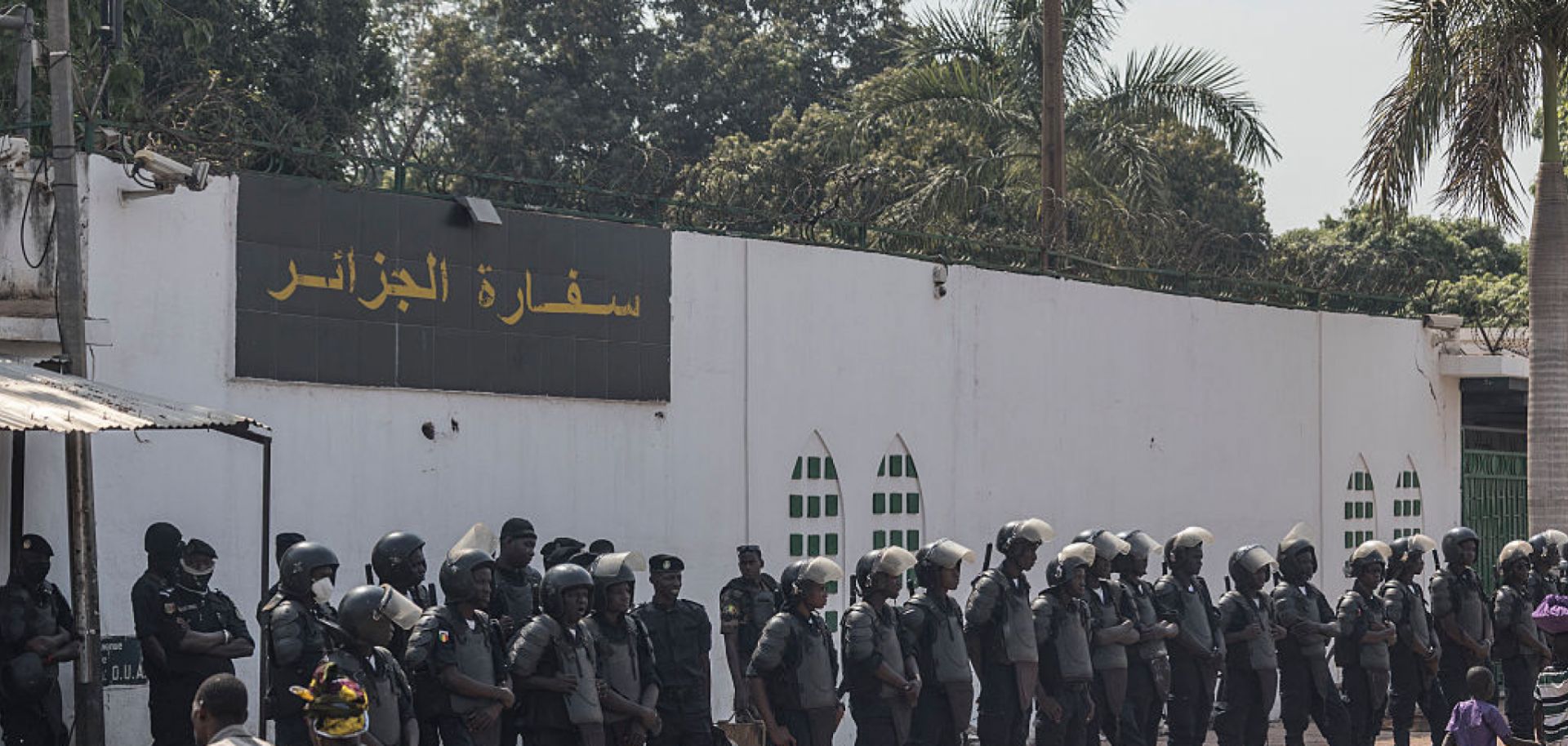 Anti-riot police officers on April 8 in front of the Algerian Embassy in Bamako, Mali.