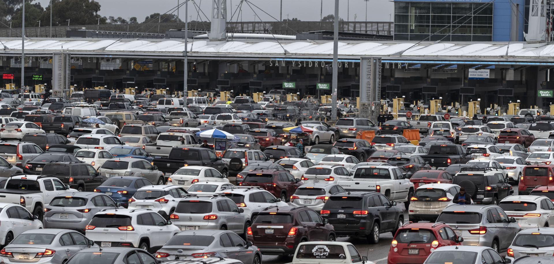Cars line up on the Mexican side of the San Ysidro crossing port at the U.S.-Mexico border in Tijuana, Mexico, on March 12, 2020.