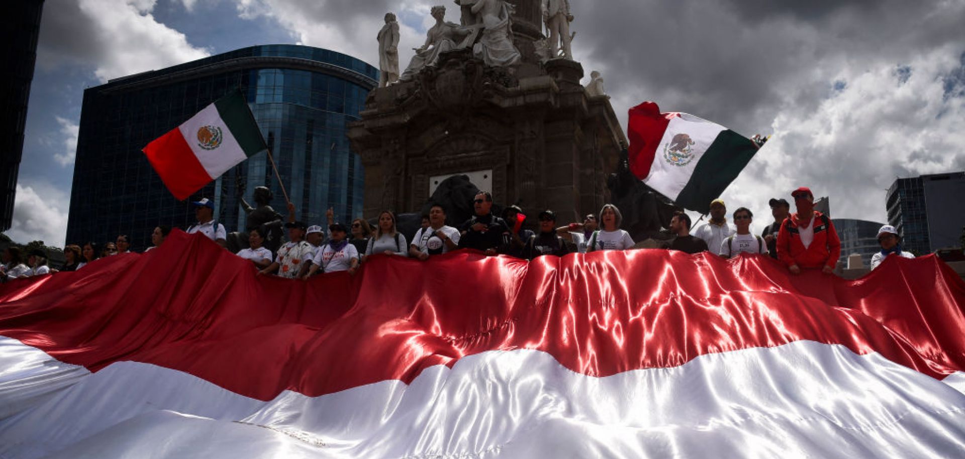 Members of the National Association of Magistrates and District Judges hold a massive Mexican flag during a protest in Mexico City, Mexico, on Sept. 11, 2024, after Mexico's Senate approved controversial judicial reforms. 