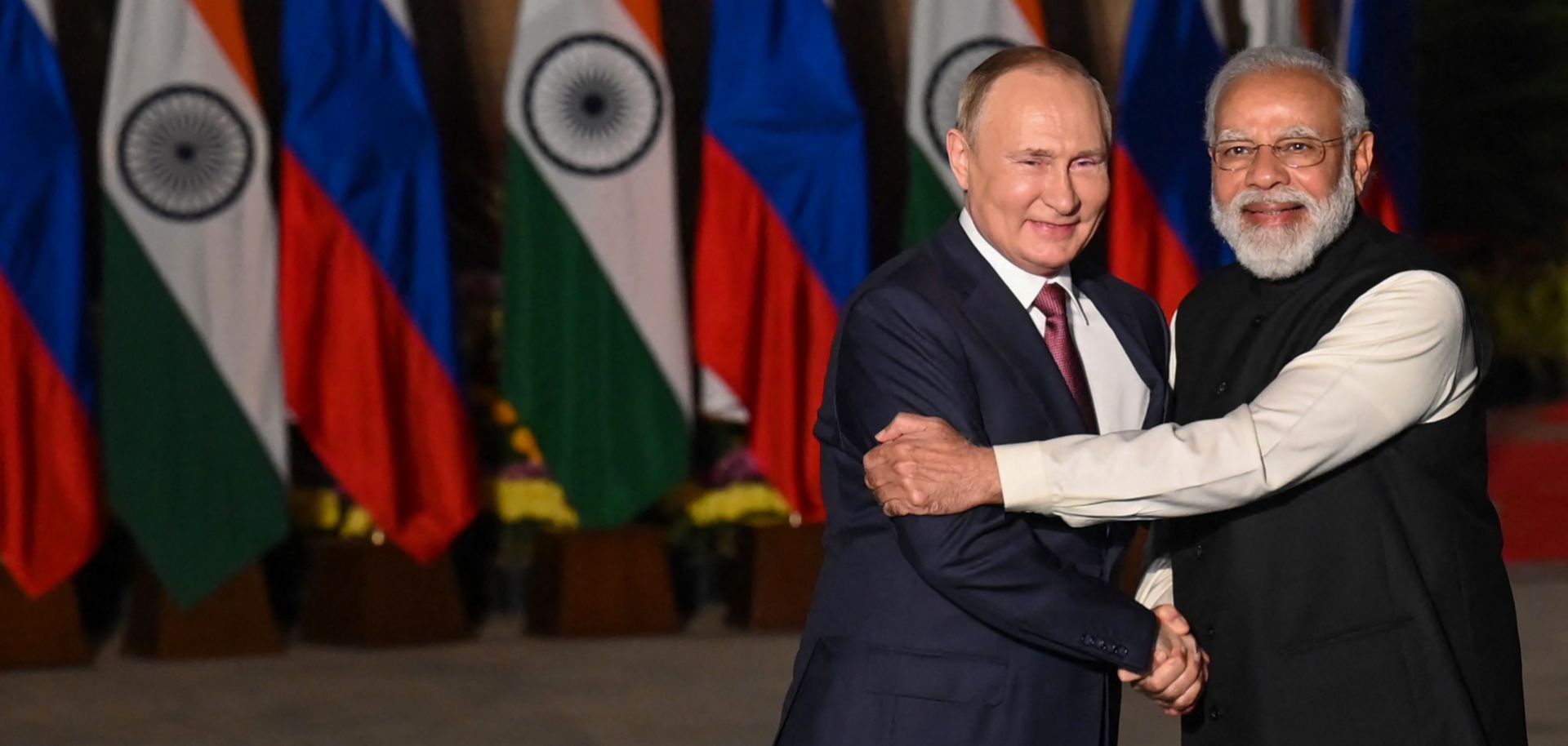 India's Prime Minister Narendra Modi (R) greets Russian President Vladimir Putin (L) before a meeting at Hyderabad House in New Delhi, India, on Dec. 6, 2021.