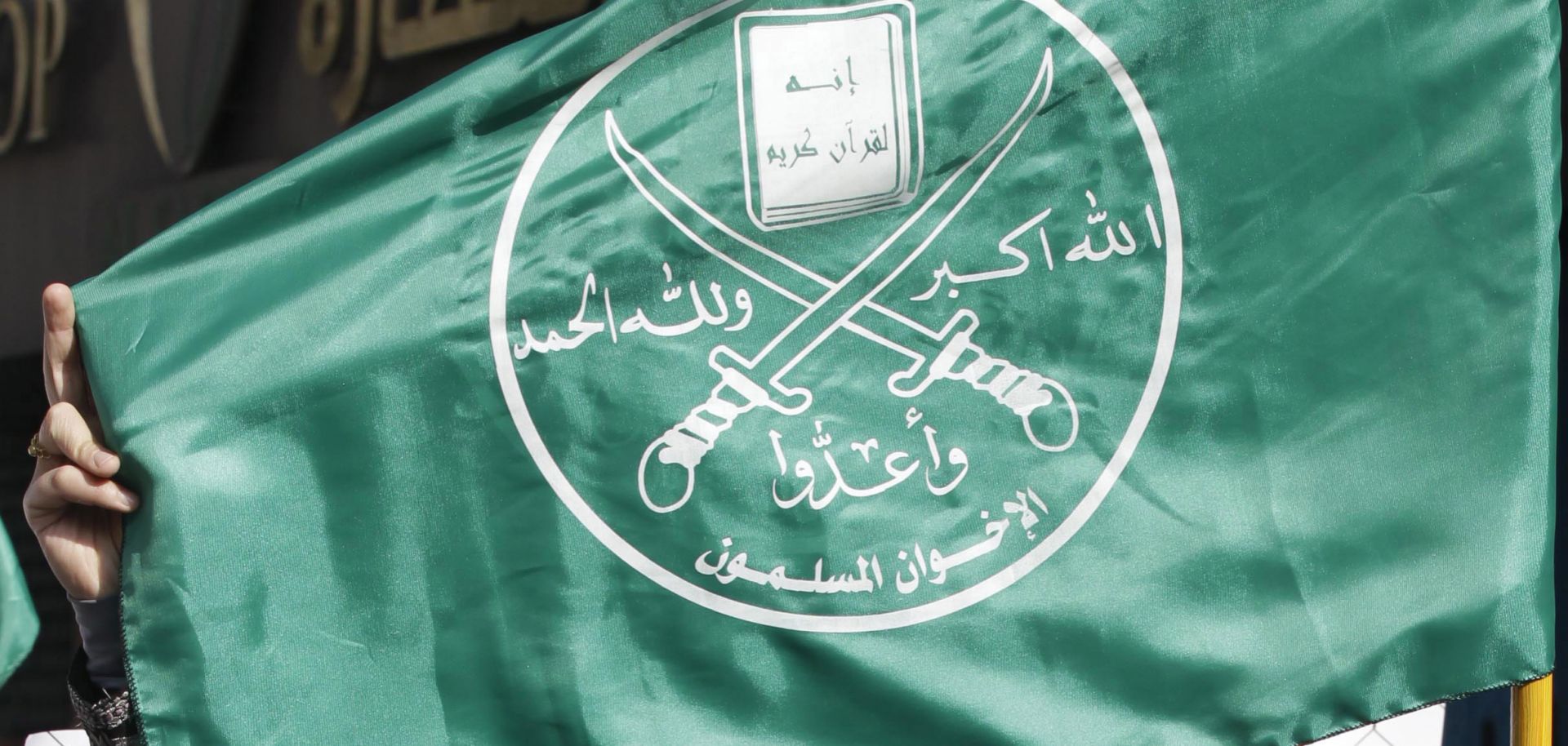 Supporters of the Muslim Brotherhood in Jordan hold the movement's flag during a demonstration in the capital, Amman, on Nov. 28, 2014.