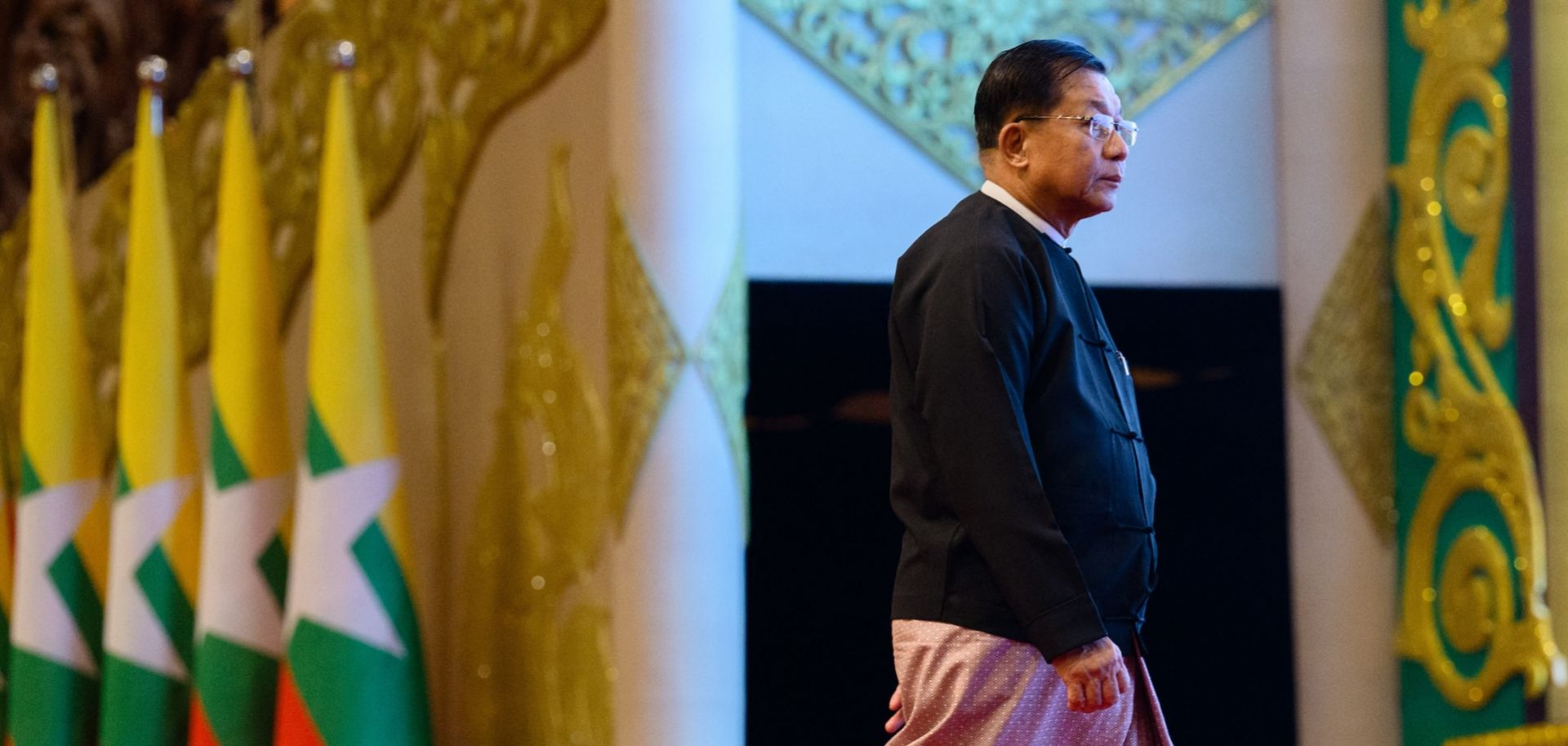 Myanmar's then-military chief Min Aung Hlaing prepares to deliver a speech during a memorial event at the Myanmar International Convention Center in Naypyidaw on March 28, 2026, to mark the first anniversary since a 7.7-magnitude tremor killed more than 3,800 people in Myanmar.