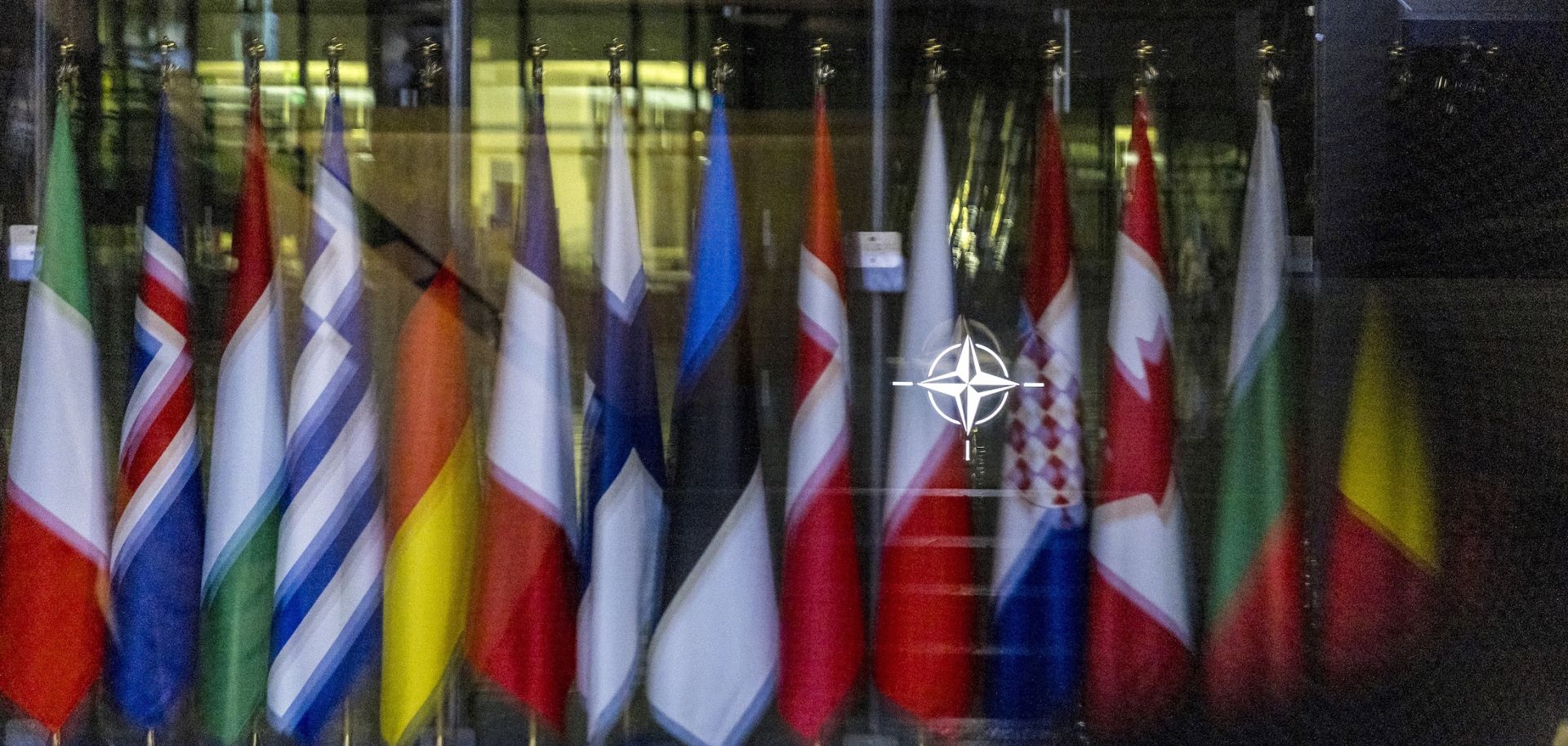 The NATO symbol and flags of some member countries Oct. 18 in Brussels.