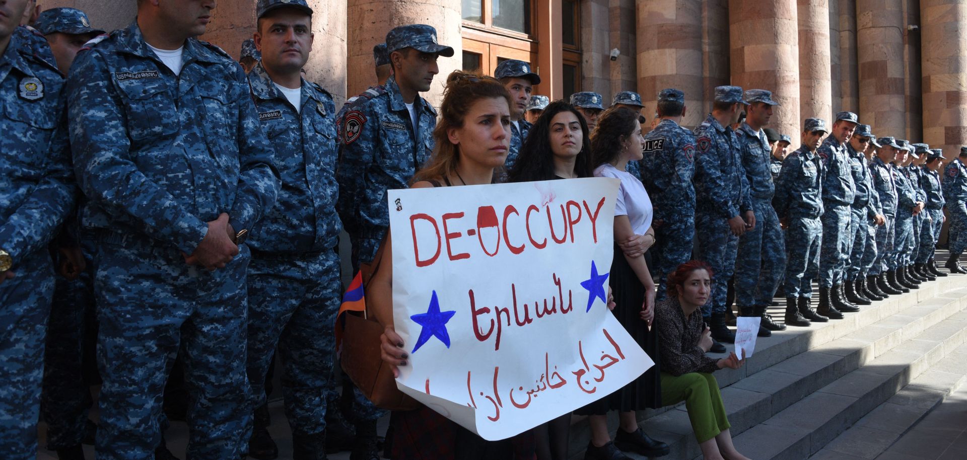 Armenians protest outside the government building in central Yerevan to urge the government to respond to the Azerbaijani military operation launched against the breakaway Nagorno-Karabakh region on Sept. 19, 2023.