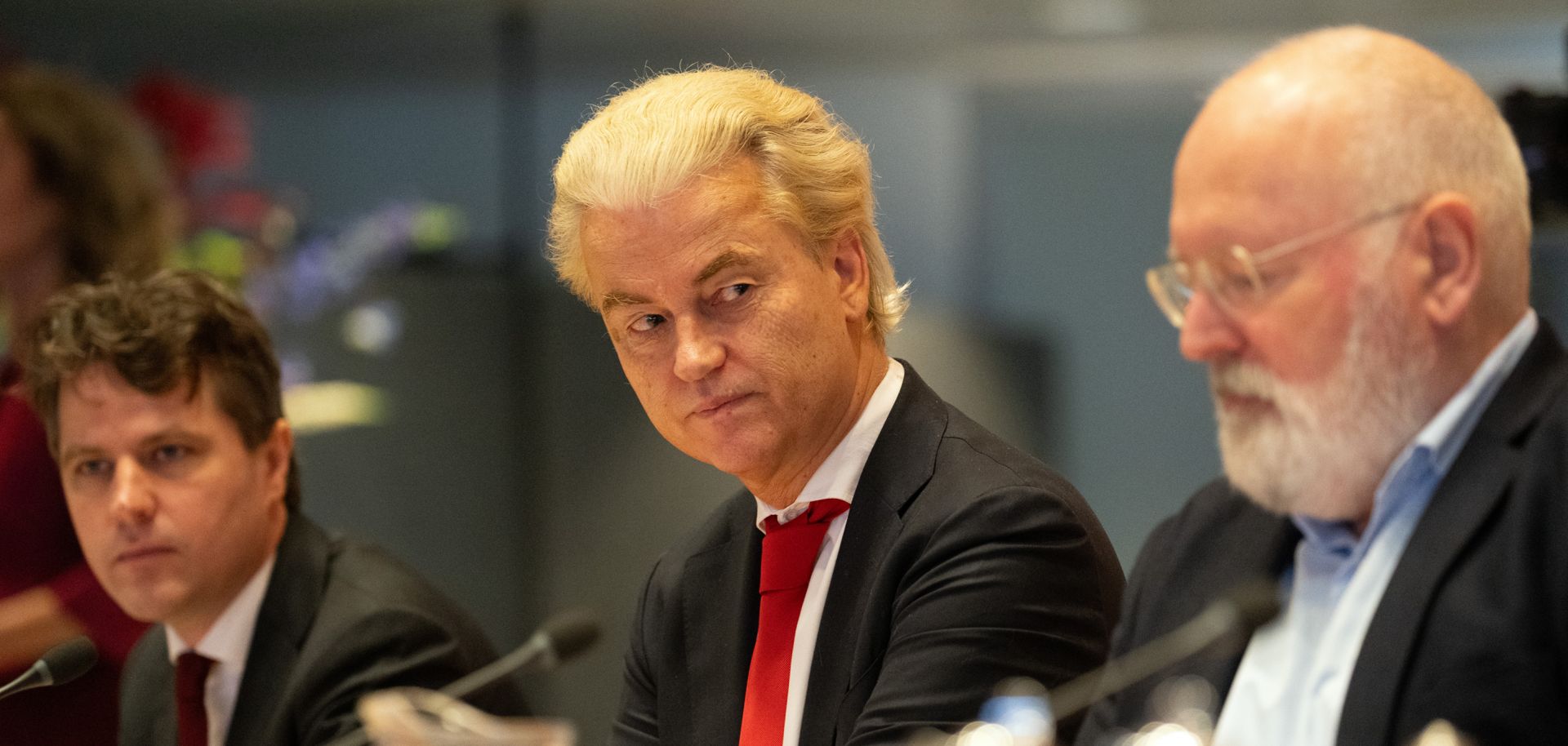 Geert Wilders (C), leader of the far-right Party for Freedom, sits next to Frans Timmermans (R), leader of the Green Left-Labor Party alliance, and Henri Bontenbal (L), leader of the Christian Democratic Appeal party, during a meeting in the Dutch parliament on Nov. 24, 2023, in The Hague, Netherlands. The party leaders are discussing the formation of a coalition government following Wilders' victory in the Nov. 22 general election.