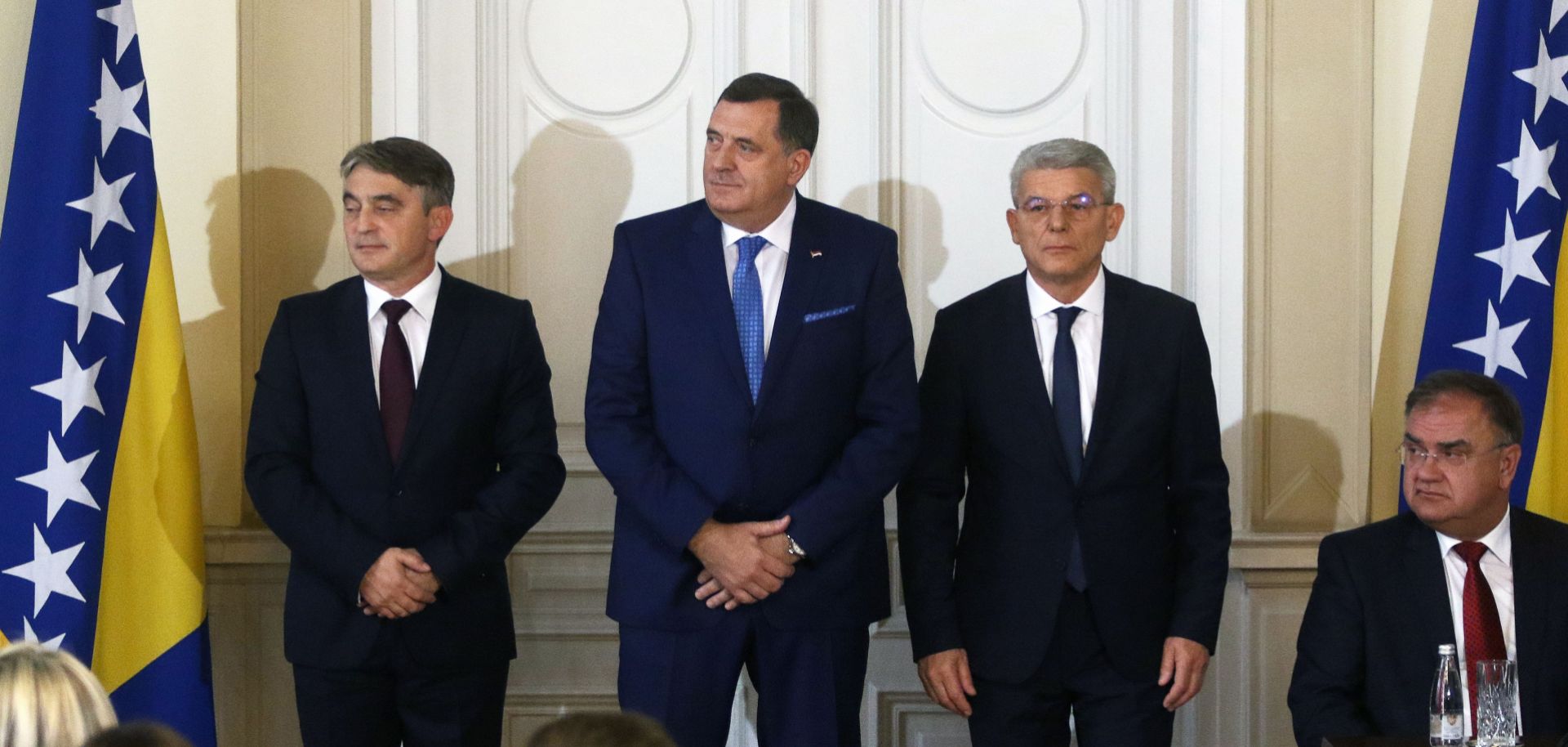 The newly elected members of Bosnia and Herzegovina's tripartite presidency pose together.