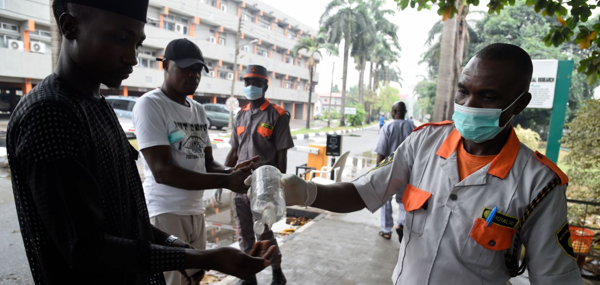 A photo of a security official administers hand sanitizer in Lagos, Nigeria, on Feb. 28, 2020. The city's 20 million residents scrambled for hygiene products following the announcement of the first confirmed coronavirus case in sub-Saharan Africa.