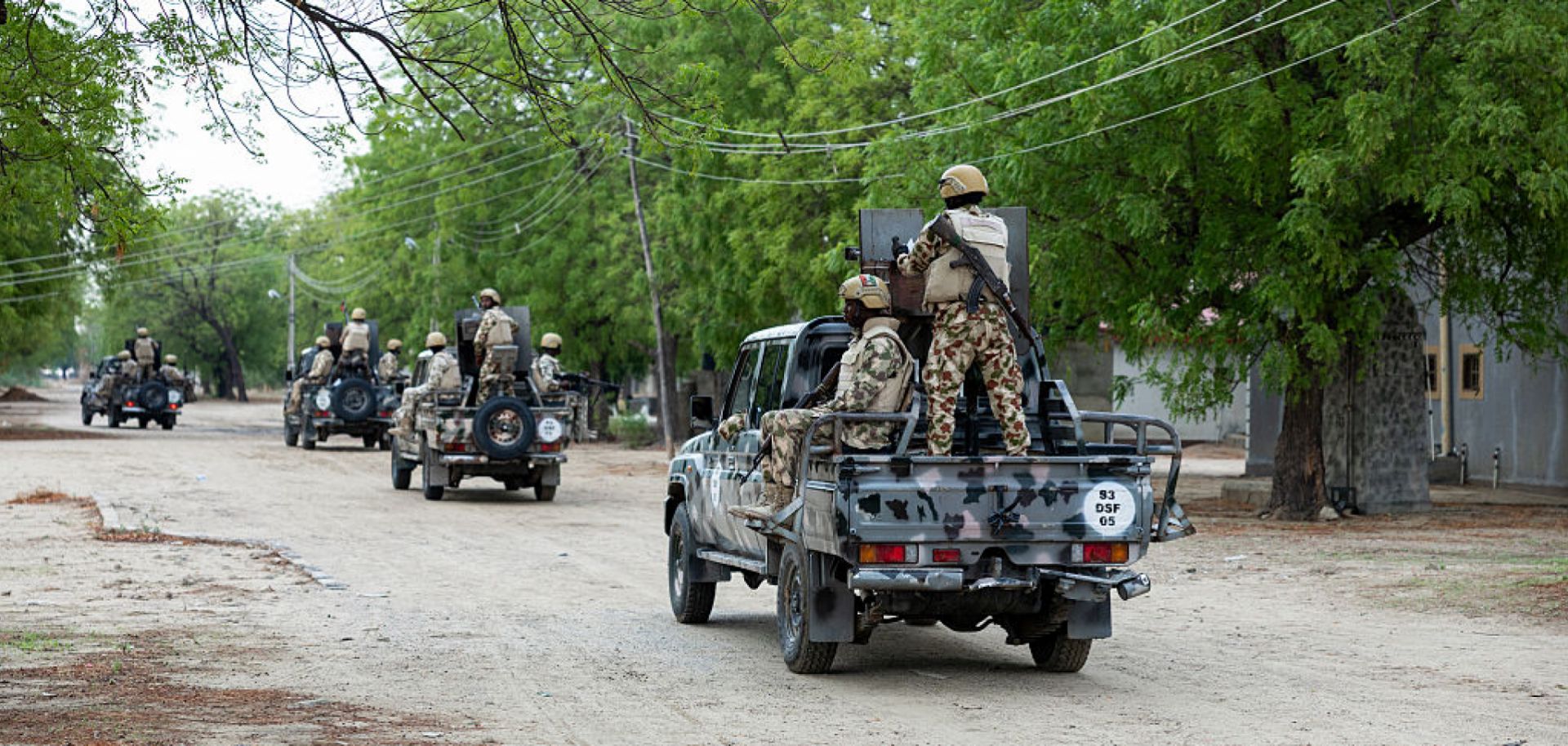 Nigerian soldiers from the Multinational Joint Task Force (MNJTF) drive in pick-ups during training at the Sector 3 MNJTF military base headquarters in Monguno, Borno state, Nigeria, on July 5, 2025. 