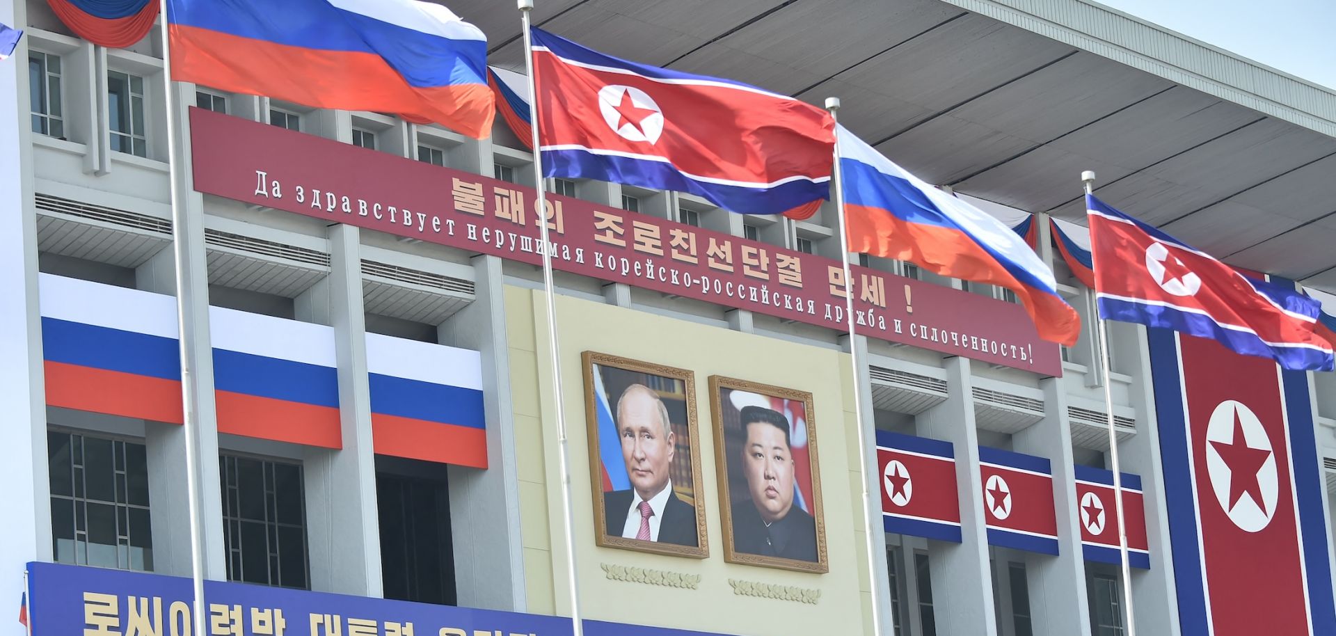 Portraits of Russian President Vladimir Putin (left) and North Korean leader Kim Jong Un are displayed in Pyongyang, North Korea, for Putin's visit to the country on June 20, 2024. 