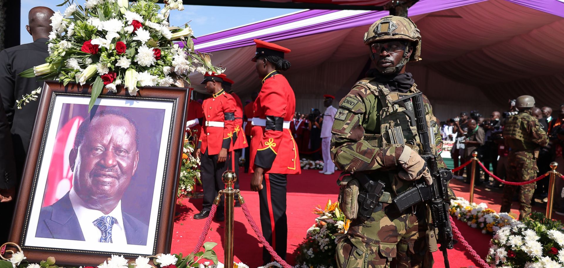 Kenyan forces stand next to the coffin of former Prime Minister Raila Odinga during a funeral mass at Jaramogi Oginga Odinga University of Science and Technology on October 19, 2025 in Bondo, Kenya.