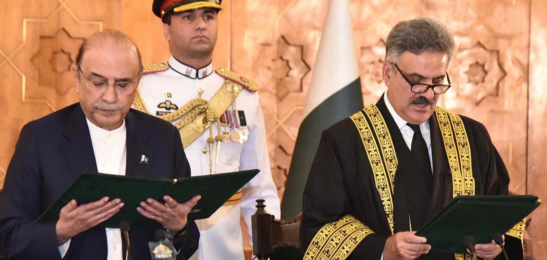 Pakistan's president administers the oath of office to Justice Yahya Afridi as Afridi is sworn in as chief justice in Islamabad on Oct. 26, 2024.