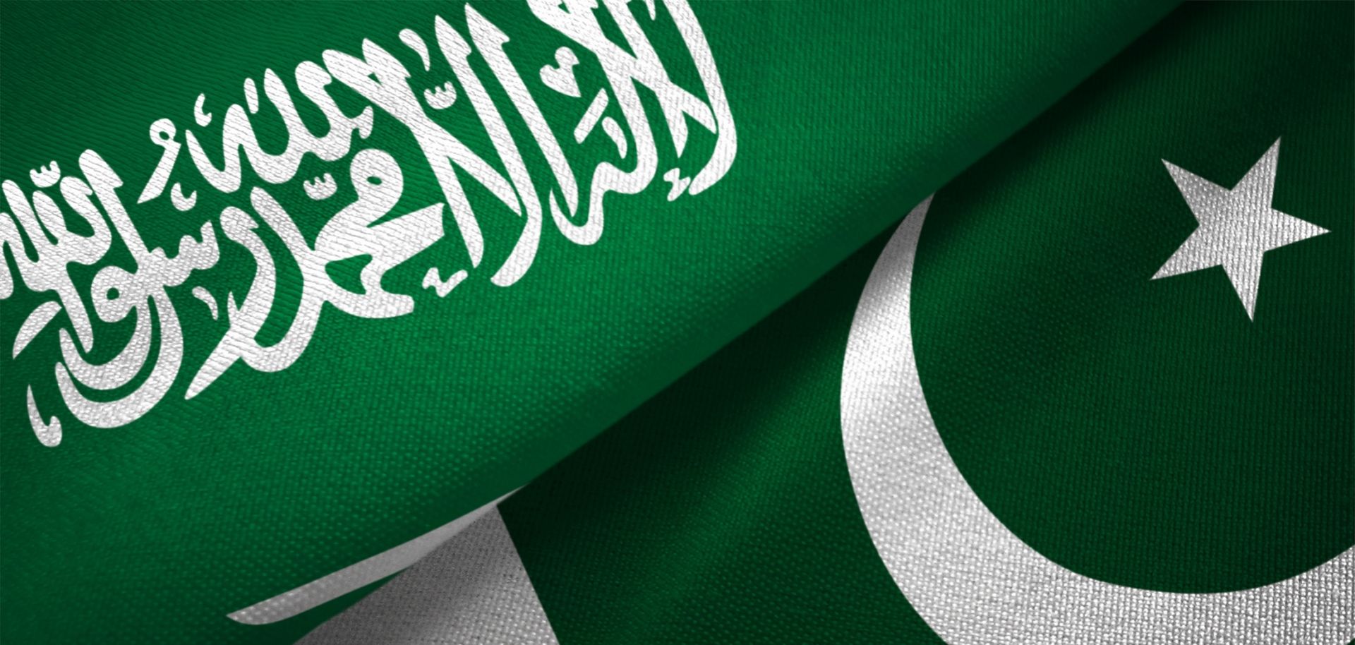 A digital illustration of Pakistan and Saudi Arabia’s national flags.