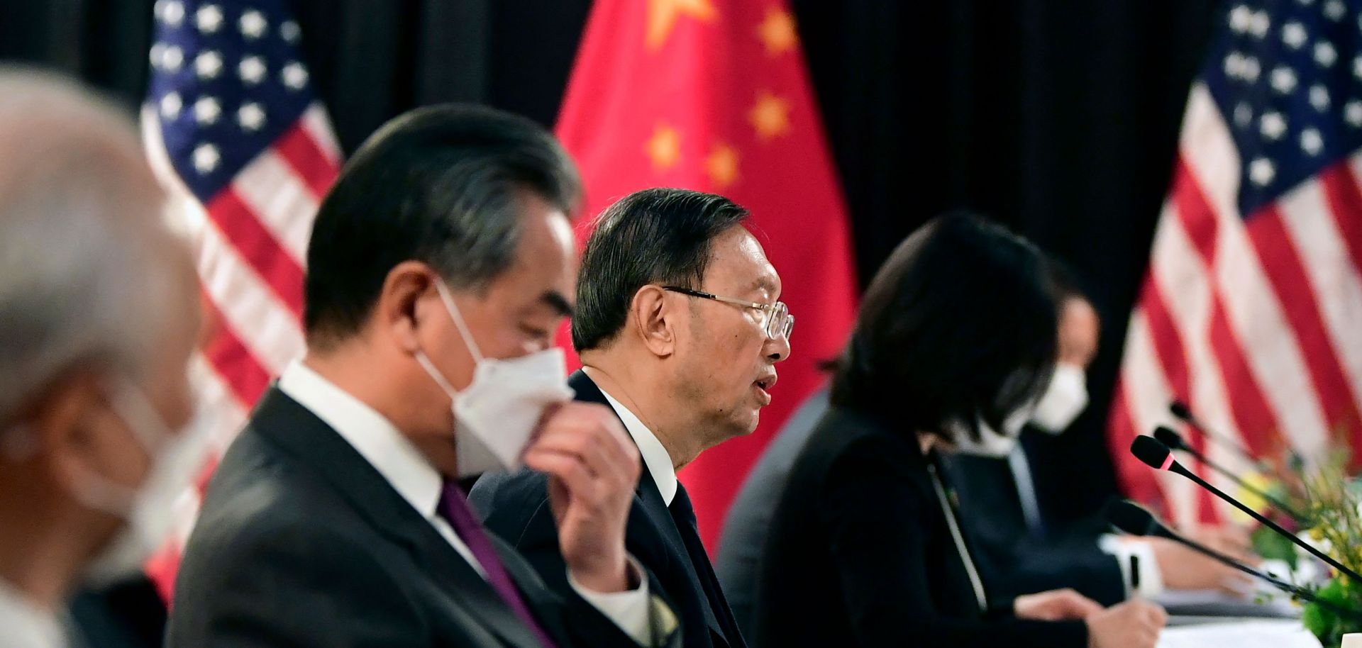 The Chinese delegation led by Yang Jiechi (C), director of the Central Foreign Affairs Commission Office and Wang Yi (2nd L), China's Foreign Minister, speak with their US counterparts at the opening session of US-China talks at the Captain Cook Hotel in Anchorage, Alaska