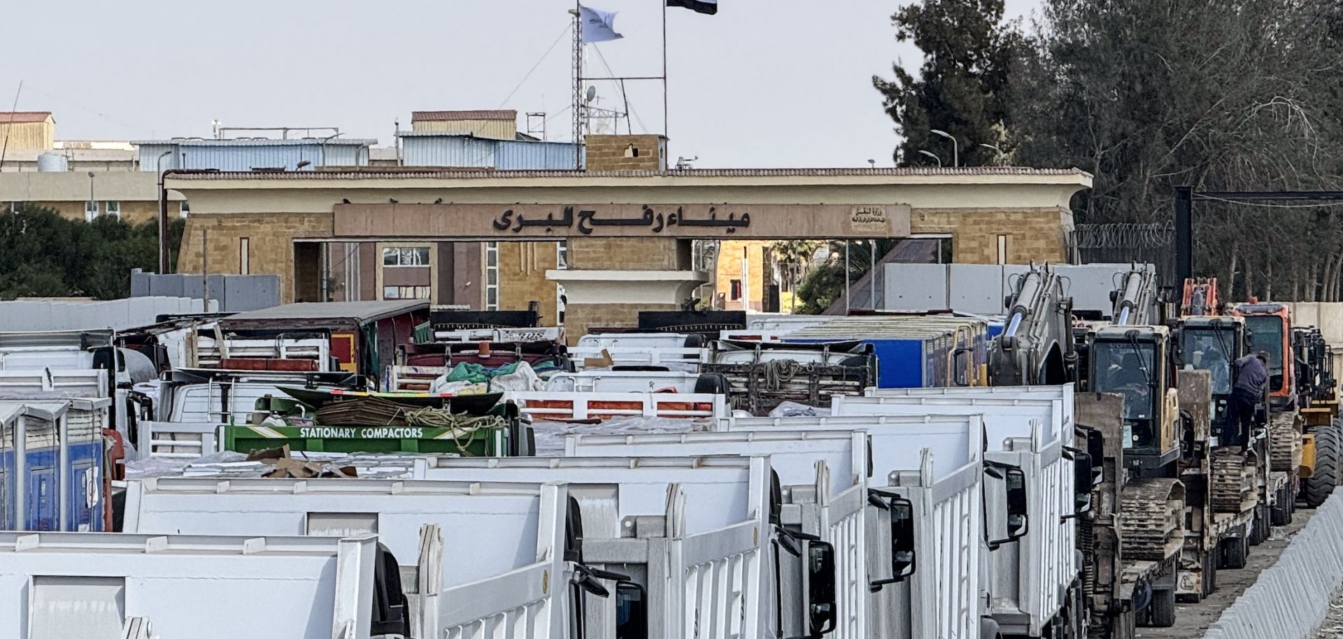 Egyptian trucks and heavy machinery on Oct. 26, 2025, on the Egyptian side of the Rafah border crossing with the Gaza Strip.