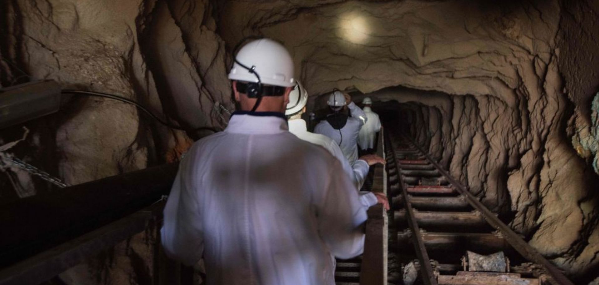 Visitors walk down the inclined shaft at Steenkampskraal rare-earth mine on July 29, 2019, about 80 kilometers (about 50 miles) from Vanrhynsdorp, a town in Western Cape province, South Africa.