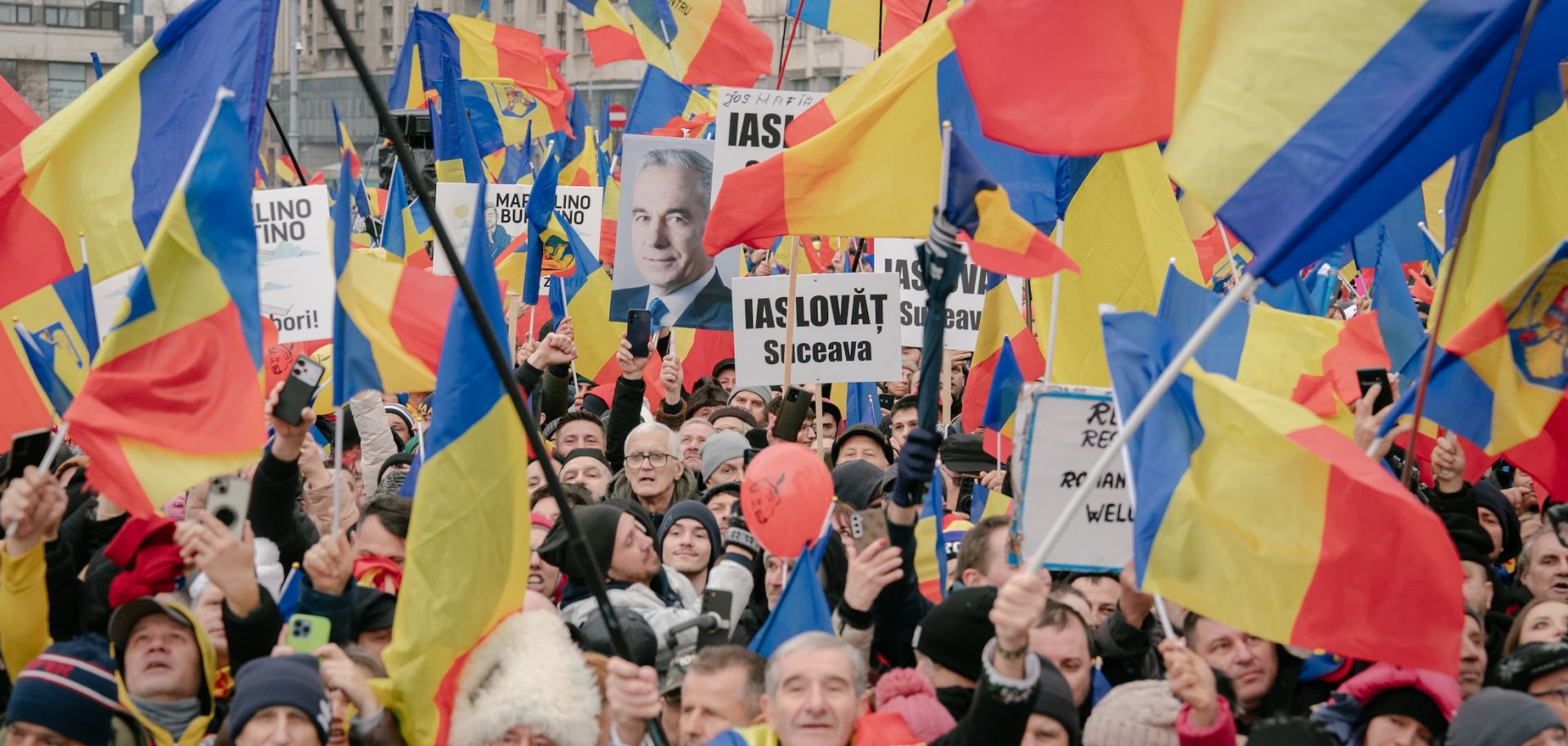 Supporters of the far-right Romanian politician Calin Georgescu take part in an anti-government protest in Bucharest on March 1, 2025. 