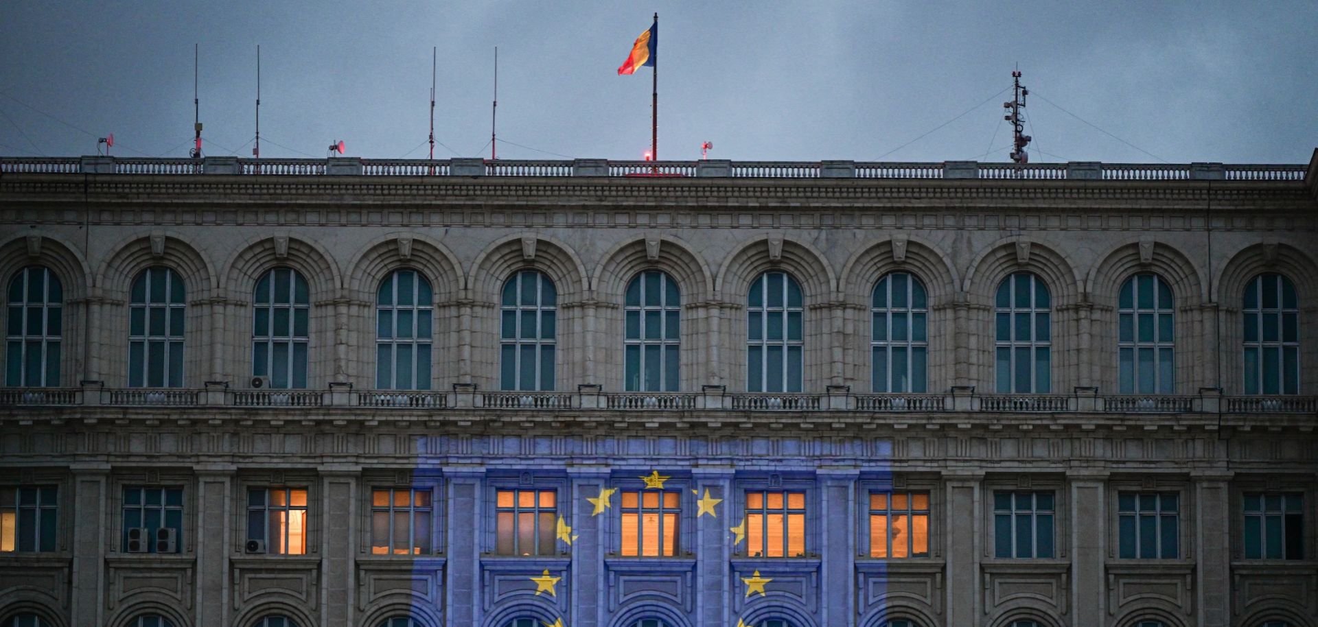 The EU flag is projected on the facade of Romania's parliament building in Bucharest on the eve of Europe Day on May 8, 2024. 