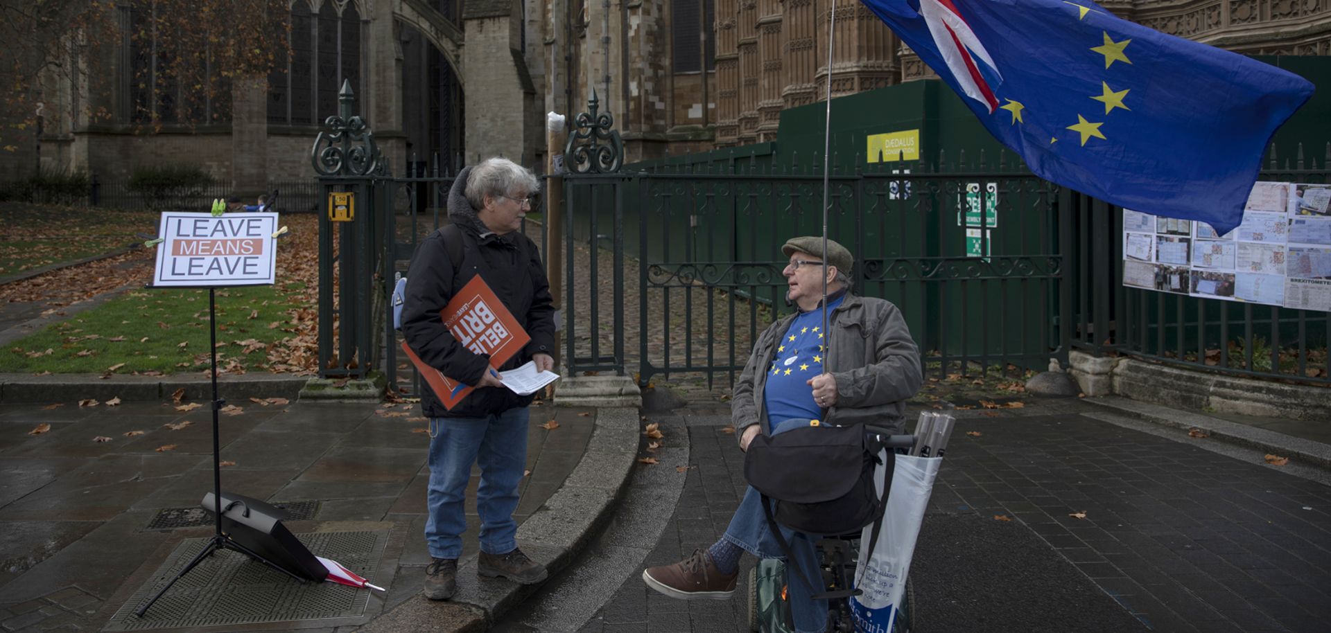 Campaigners on opposite sides of the Brexit issue chat outside the Houses of Parliament on Dec. 5, 2018, in London.