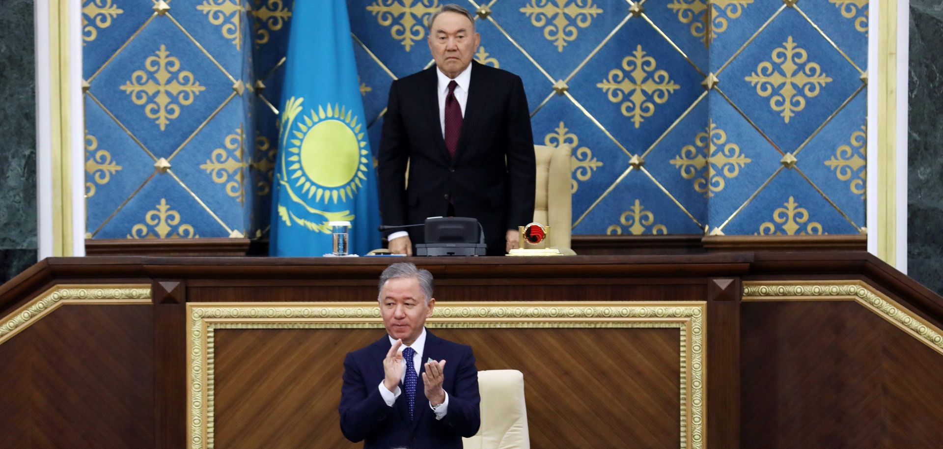 Former Kazakh President Nursultan Nazarbayev, top, and Kazakhstan's interim president Kassym-Jomart Tokayev, bottom, attend a joint session of Parliament on March 20, 2019.