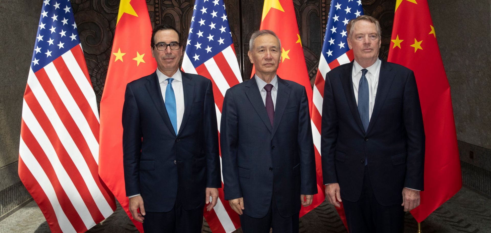 U.S. Treasury Secretary Steven Mnuchin (left) and U.S. Trade Representative Robert Lighthizer flank Chinese Vice Premier Liu He as they pose for photographs before holding trade talks in Shanghai on July 31, 2019.