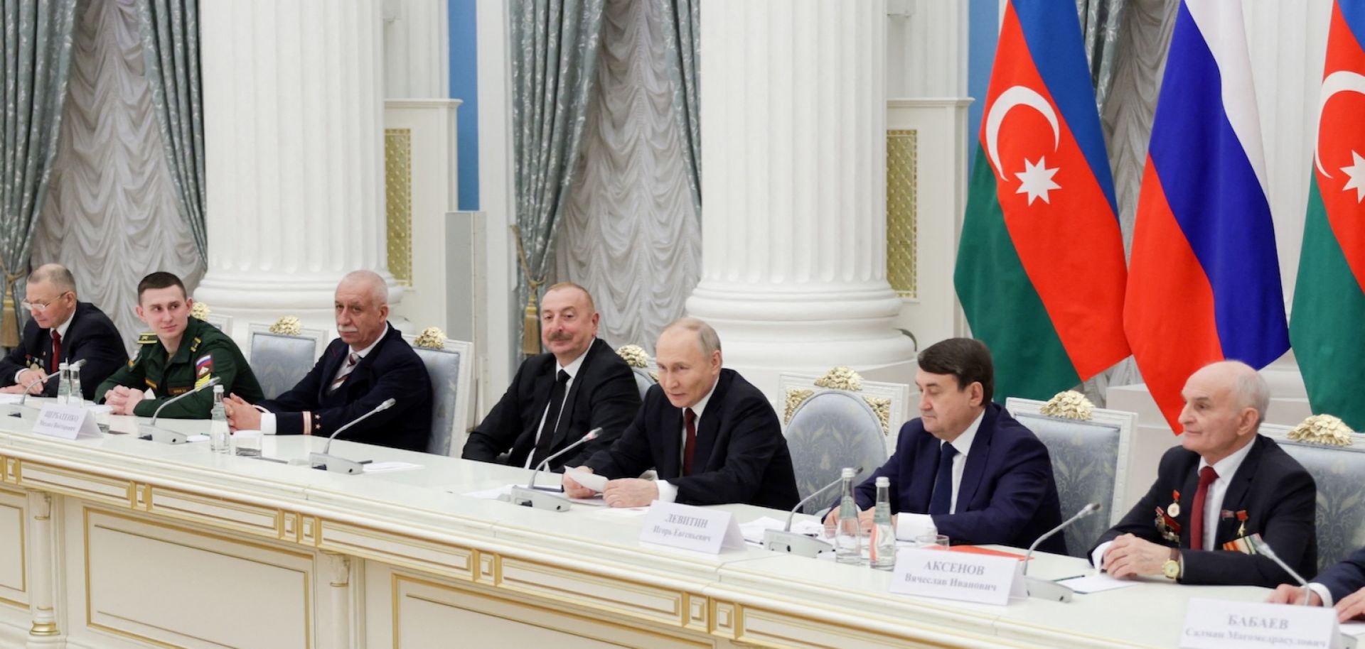 Azerbaijani President Ilham Aliyev (4th from left) and Russian President Vladimir Putin (5th from left) attend a meeting in Moscow on April 22, 2024. 