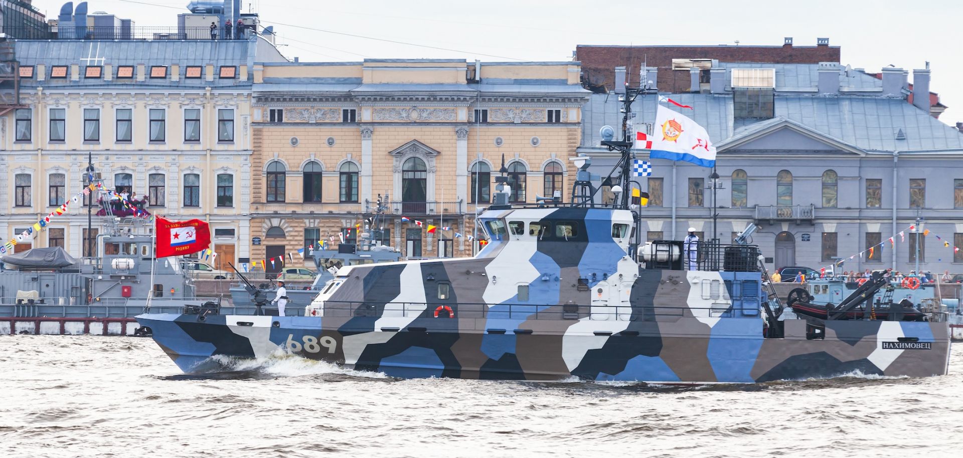 A Russian warship transits the Neva River in Saint Petersburg, Russia.