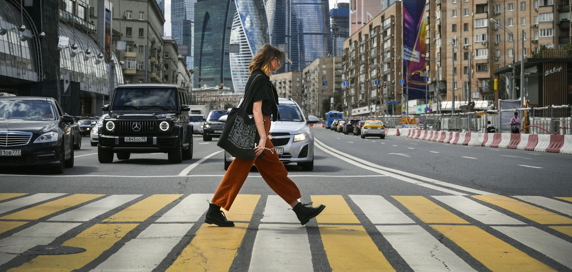 This photo shows a woman crossing a street near downtown Moscow, Russia.