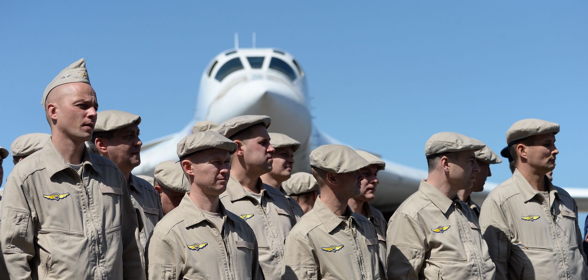 Russian air force personnel stand in front of a Tupolev Tu-160 long-range strategic bomber upon landing at Simon Bolivar International Airport, north of Caracas, Venezuela, on Dec. 10, 2018.