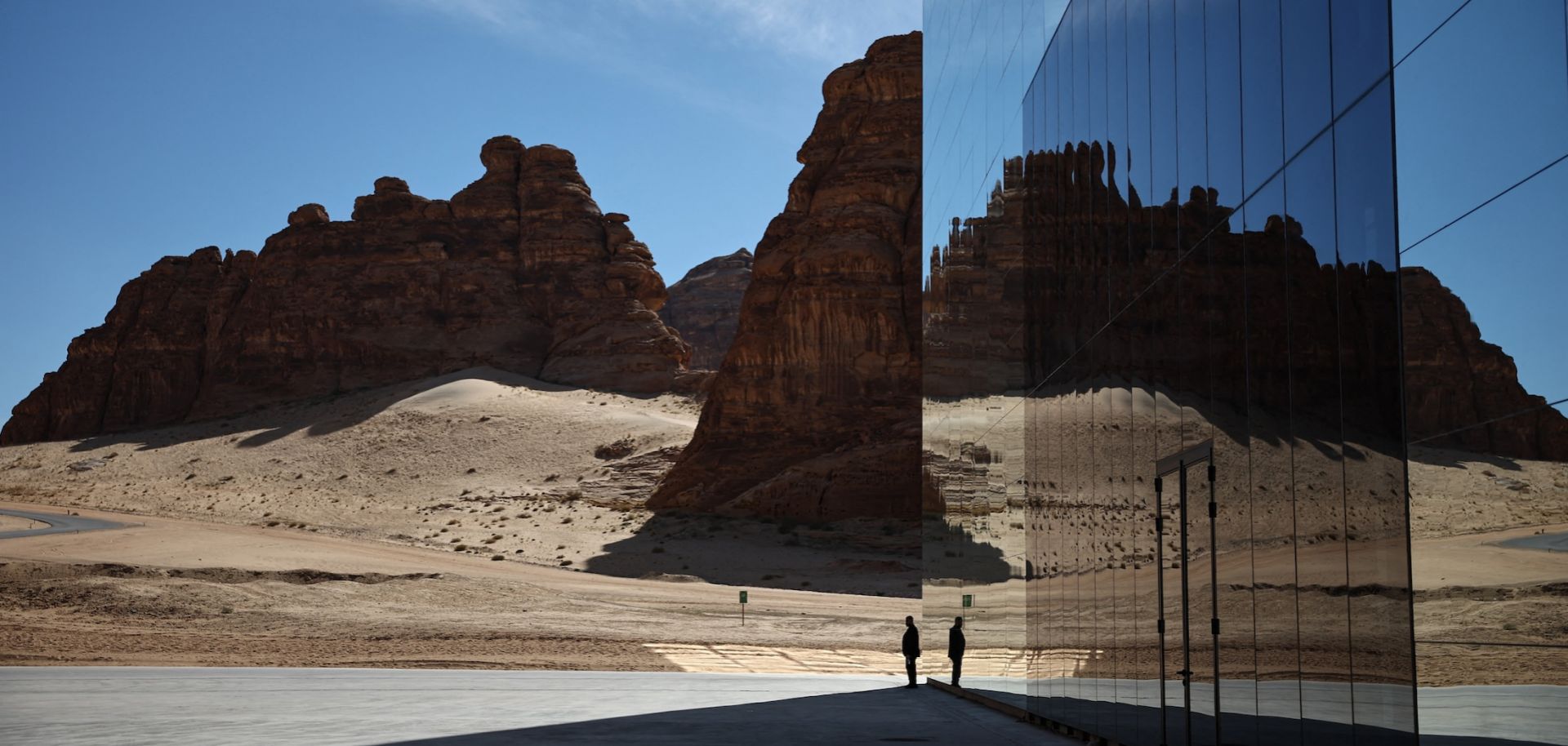 A man walks in front of the Maraya (Mirror), the world's largest mirrored building, in the desert canyon of Ashar Valley in Saudi Arabia's northwestern Al-Ula desert on Jan. 29, 2024.