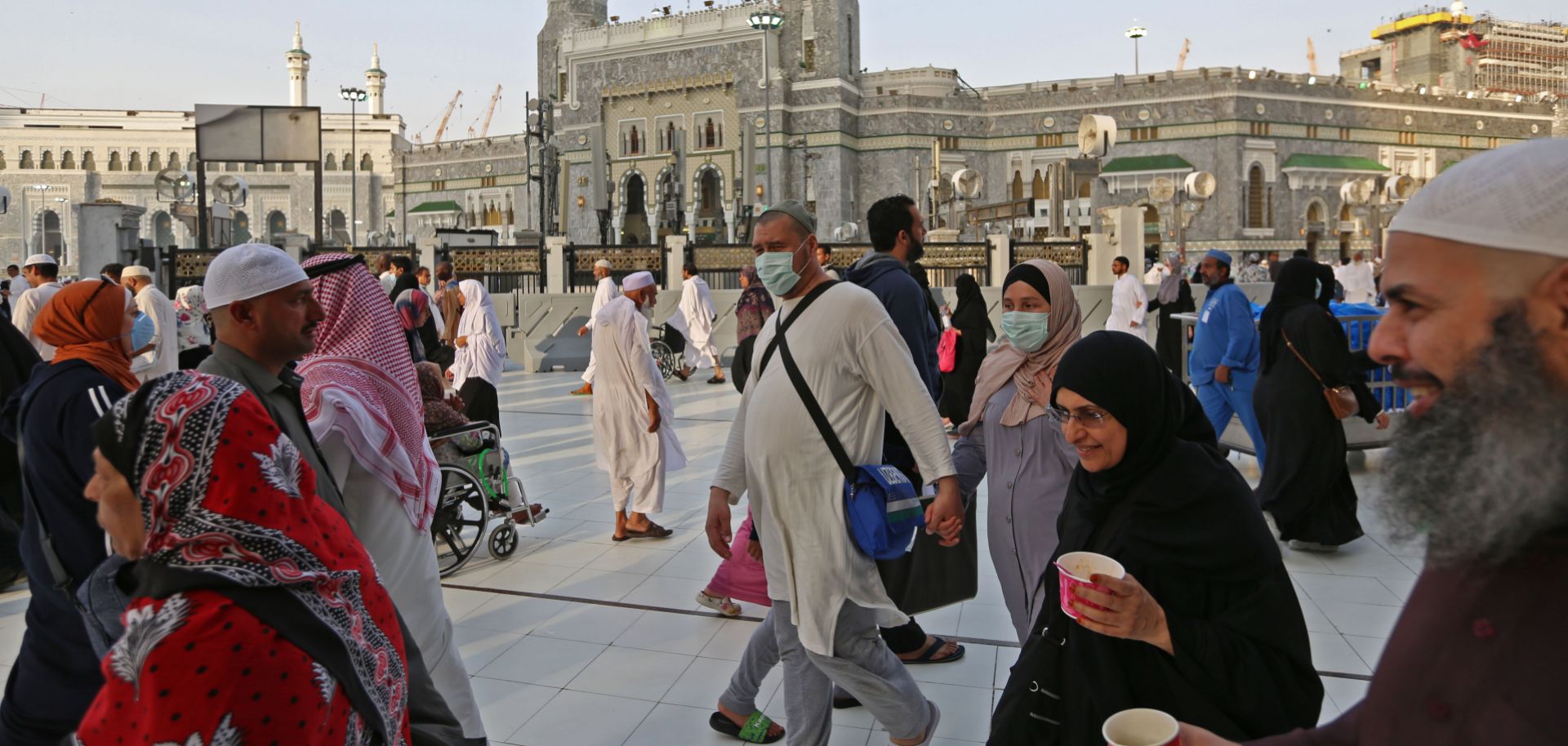 Muslim pilgrims wear masks at the Grand Mosque in Saudi Arabia's holy city of Mecca on Feb. 28, 2020. 