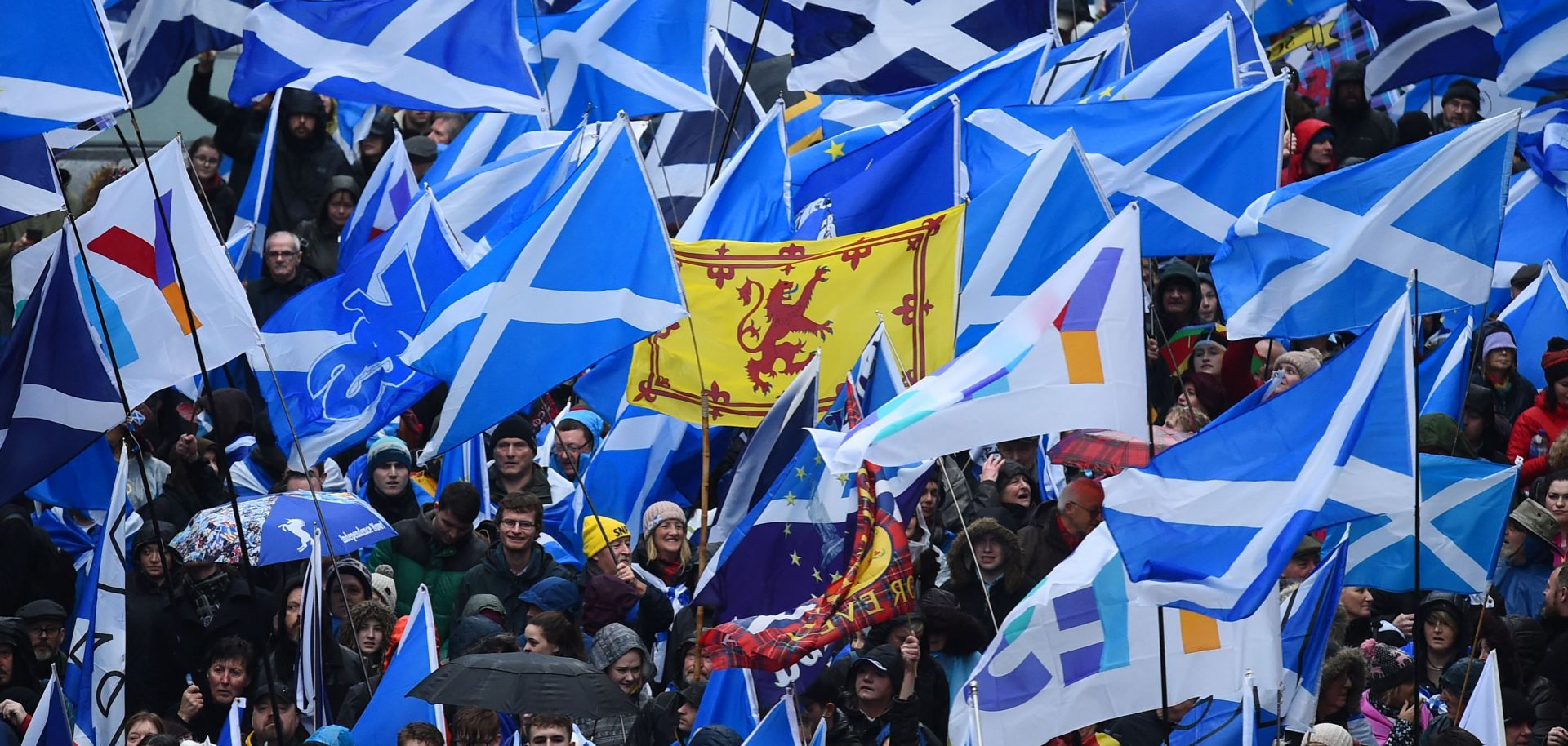 Protesters with Scottish Saltire flags attend a march calling for Scottish independence in Glasgow on Jan. 11, 2020. 