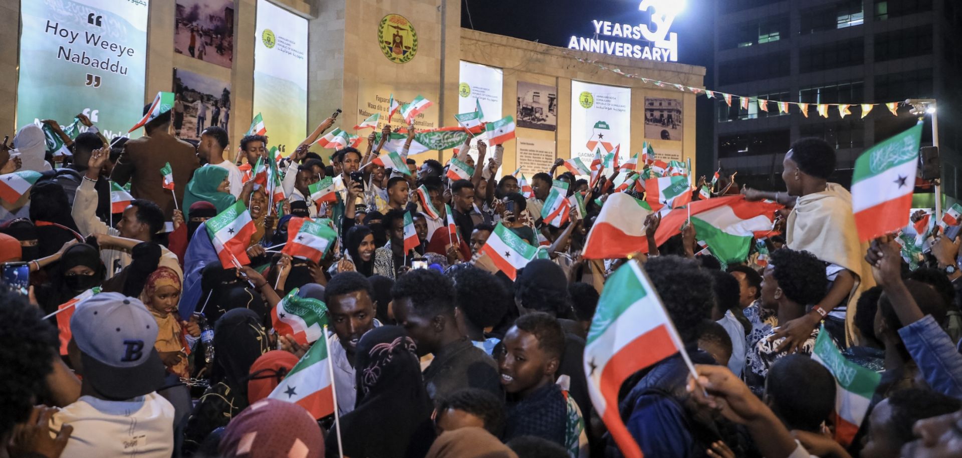 Residents wave Somaliland flags as they gather to celebrate Israel's announcement recognizing Somaliland's statehood in downtown Hargeisa, on Dec. 26, 2025. 