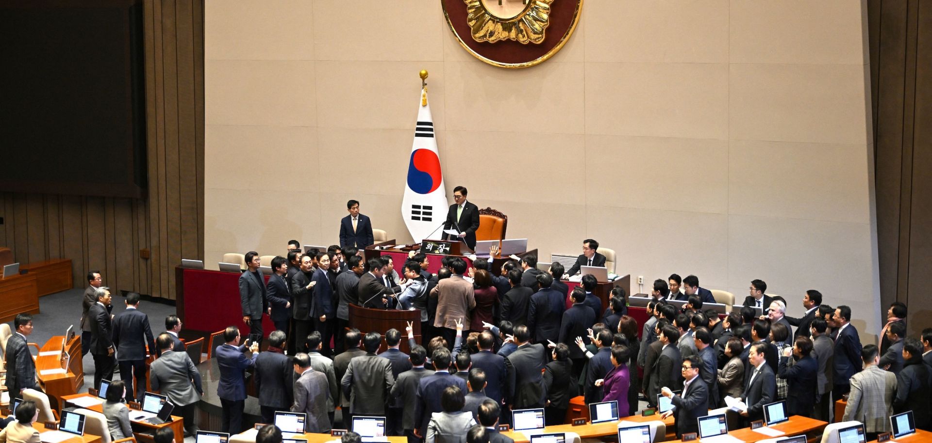 People Power Party lawmakers (bottom) argue with National Assembly Speaker Woo Won-shik (top) during the plenary session for the impeachment vote of acting president Han Duck-soo on Dec. 27, 2024, at the National Assembly in Seoul, South Korea.